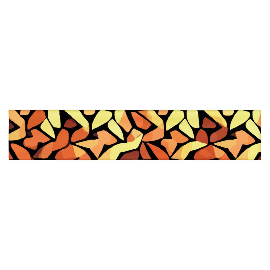 stretch headband with an abstract print in orange, yellow and brown by The Gabrielli