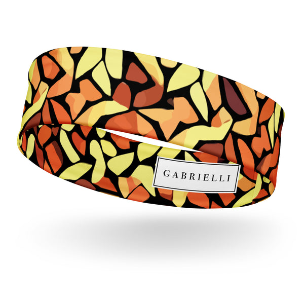 stretch headband with an abstract print in orange, yellow and brown by The Gabrielli