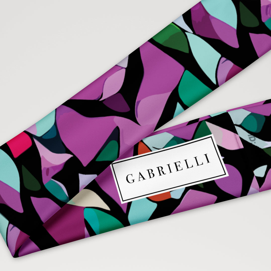 stretchy headband with a purple abstract print by The Gabrielli