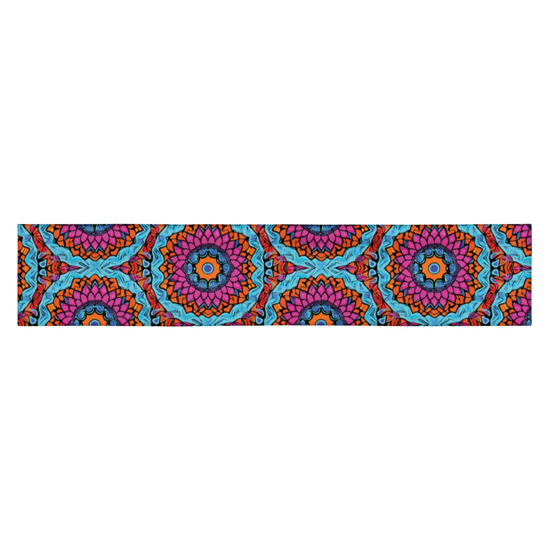 stretch headband with an abstract print in blue, pink, and orange by The Gabrielli