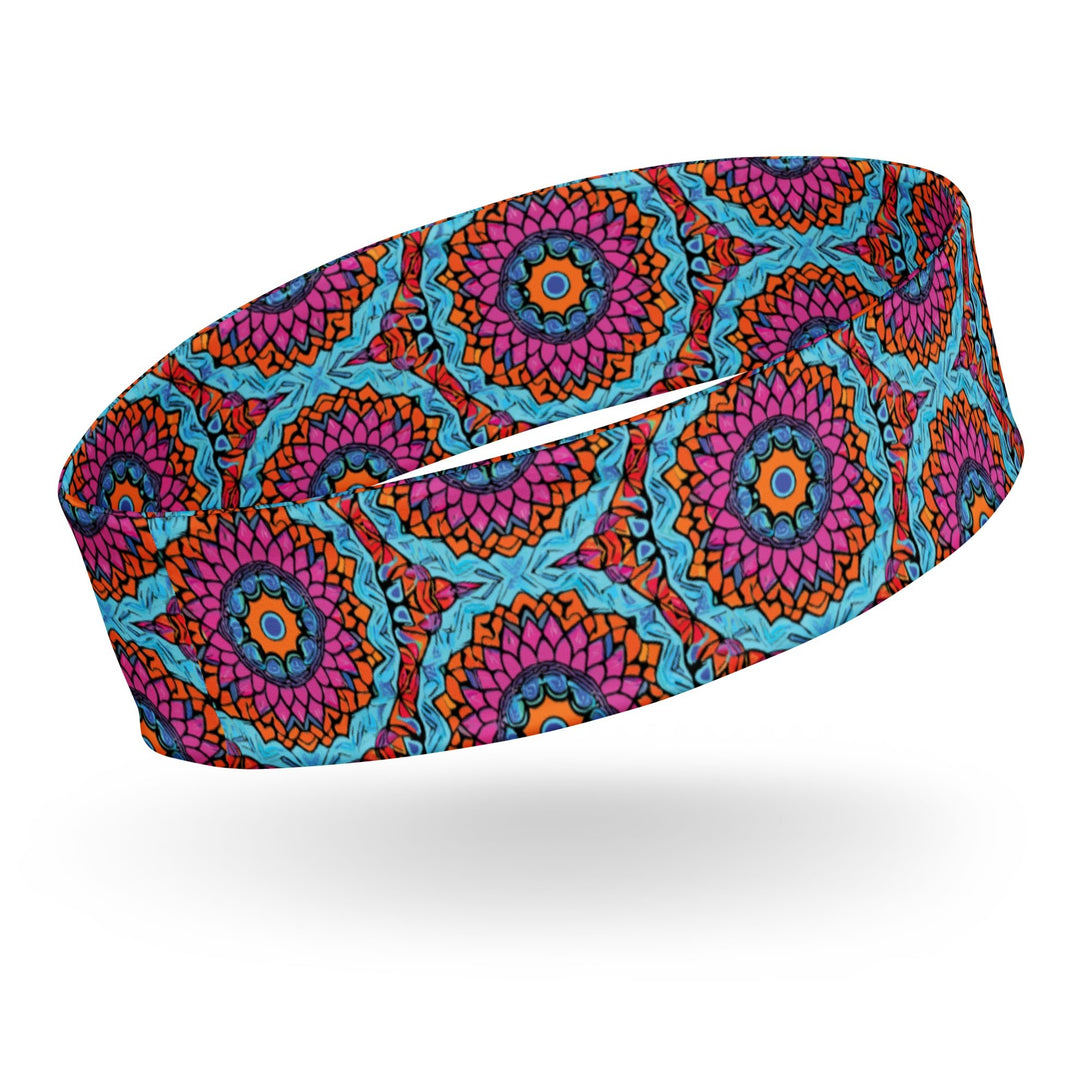 stretch headband with an abstract print in blue, pink, and orange by The Gabrielli