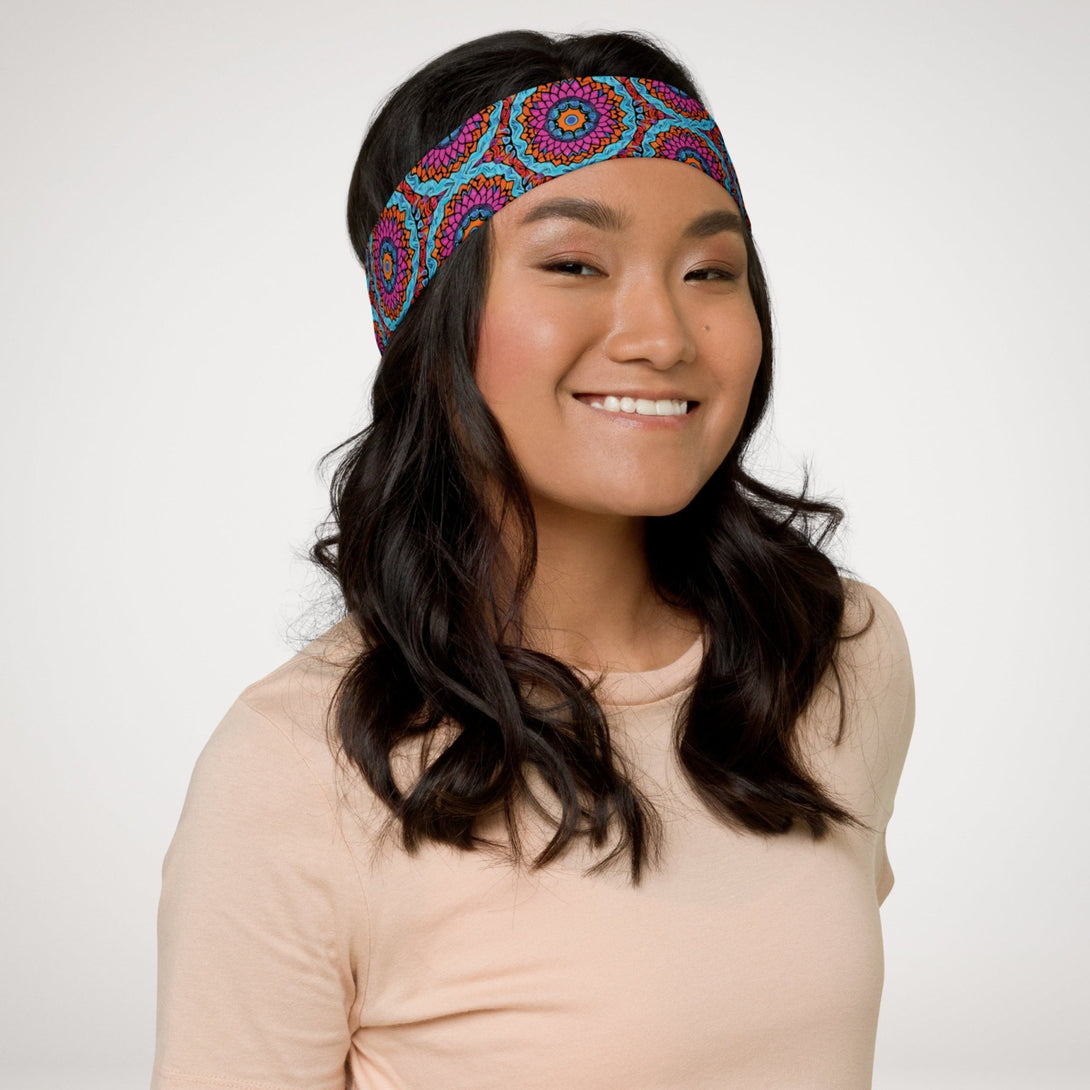 stretch headband with an abstract print in blue, pink, and orange by The Gabrielli