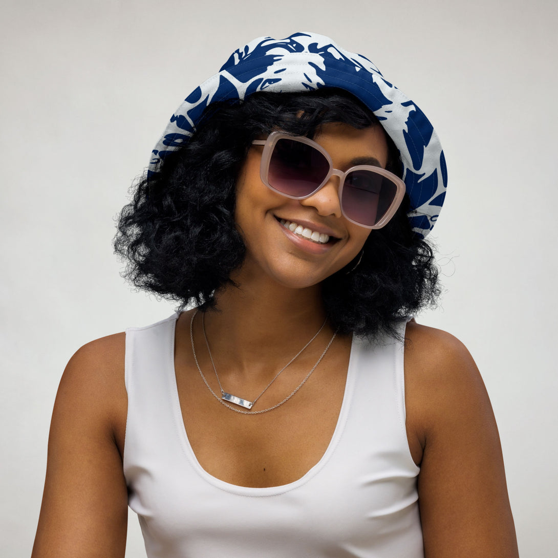 reversible bucket hat with abstract print in blue and white by The Gabrielli