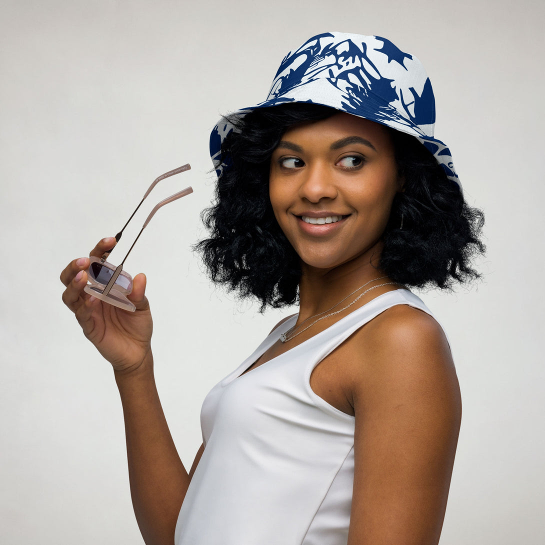 reversible bucket hat with abstract print in blue and white by The Gabrielli