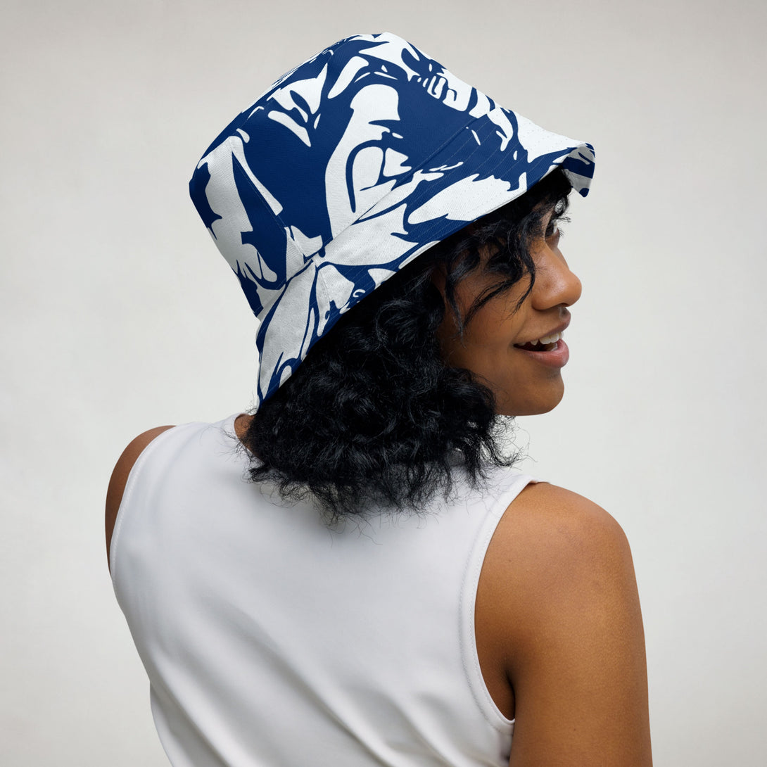 reversible bucket hat with abstract print in blue and white by The Gabrielli