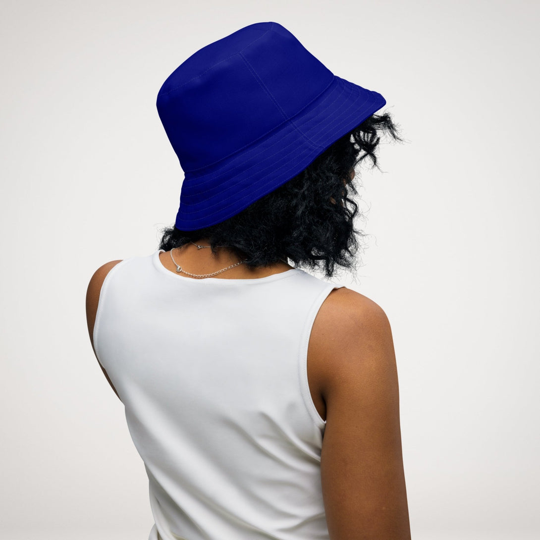 reversible bucket hat with an abstract blue and white print by The Gabrielli