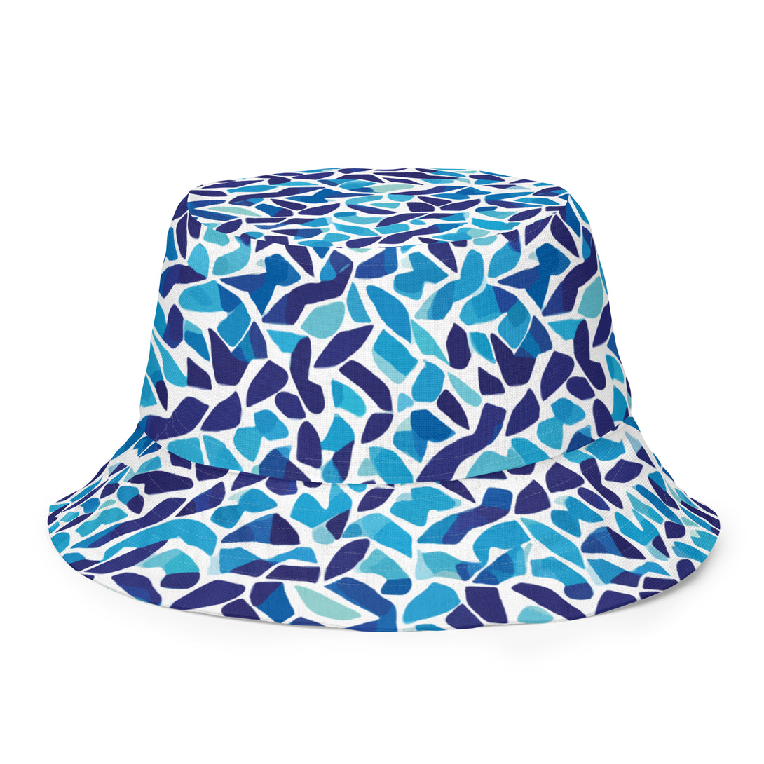 reversible bucket hat with an abstract blue and white print by The Gabrielli