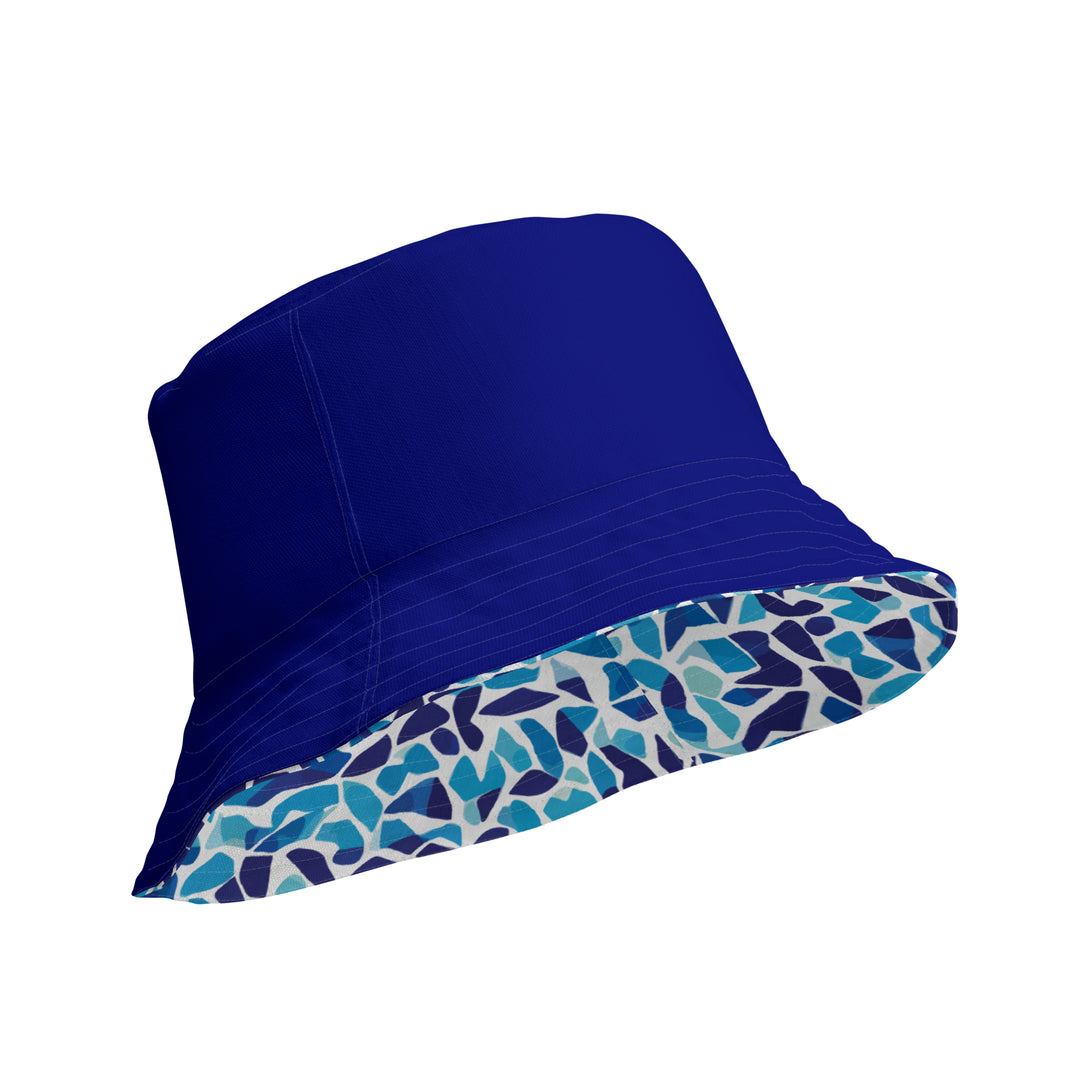 reversible bucket hat with an abstract blue and white print by The Gabrielli