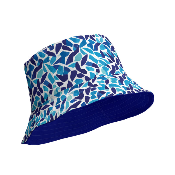 reversible bucket hat with an abstract blue and white print by The Gabrielli