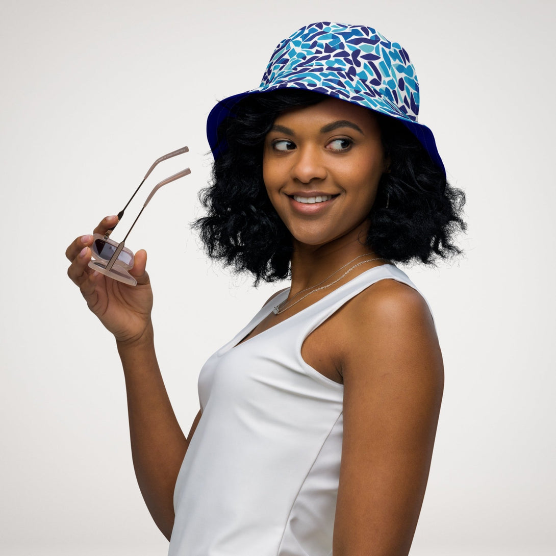 reversible bucket hat with an abstract blue and white print by The Gabrielli