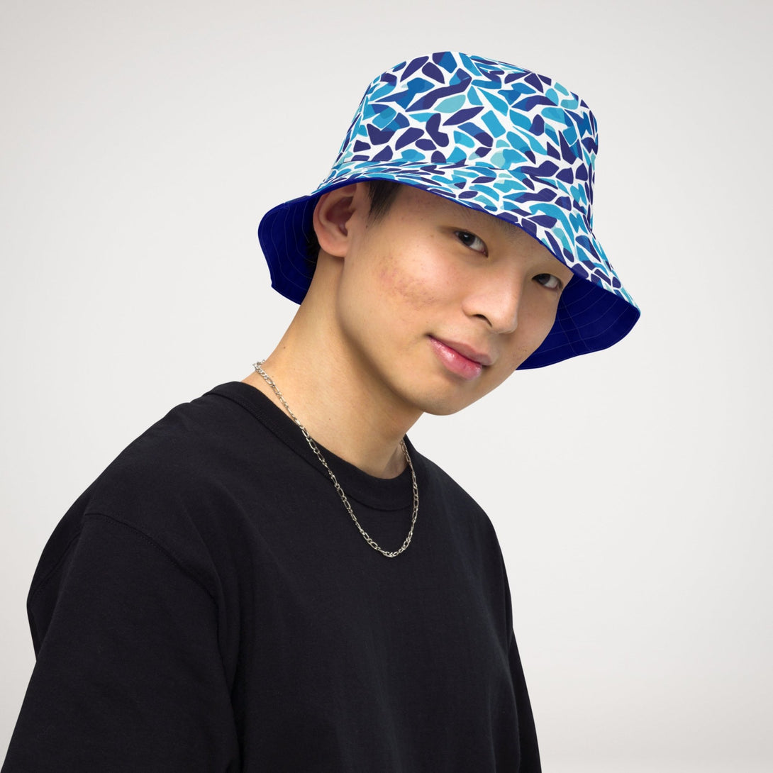 reversible bucket hat with an abstract blue and white print by The Gabrielli