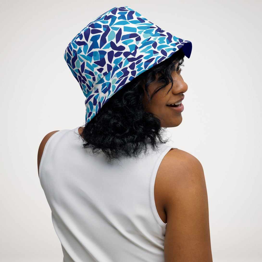 reversible bucket hat with an abstract blue and white print by The Gabrielli