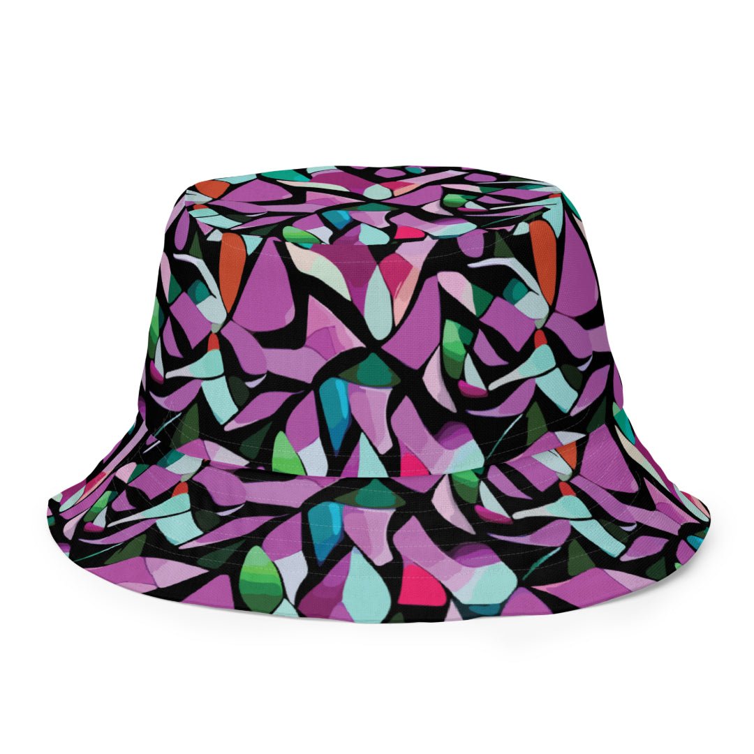 reversible bucket hat with a purple abstract print on one side and a green abstract print on the other side