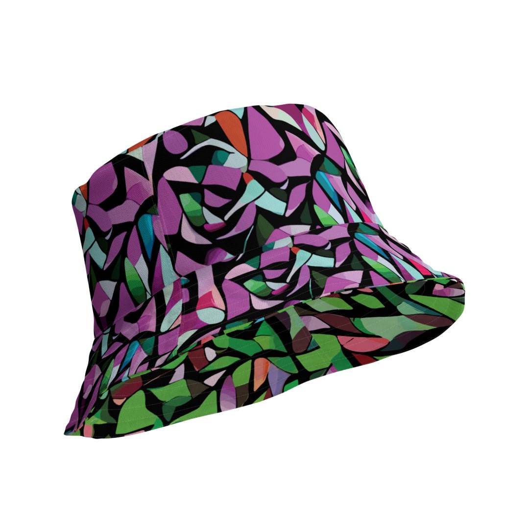 reversible bucket hat with a purple abstract print on one side and a green abstract print on the other side