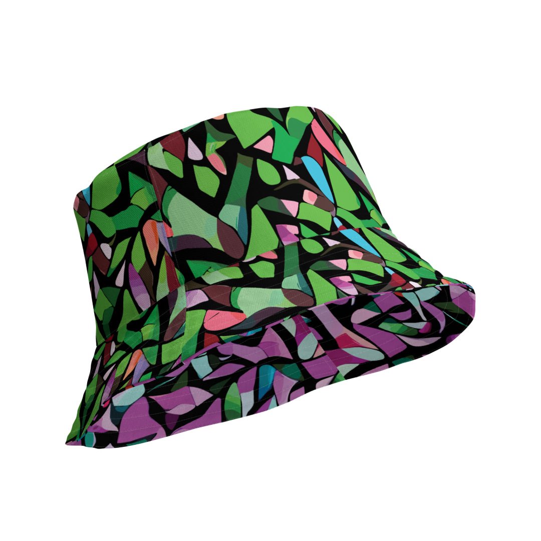 reversible bucket hat with a purple abstract print on one side and a green abstract print on the other side