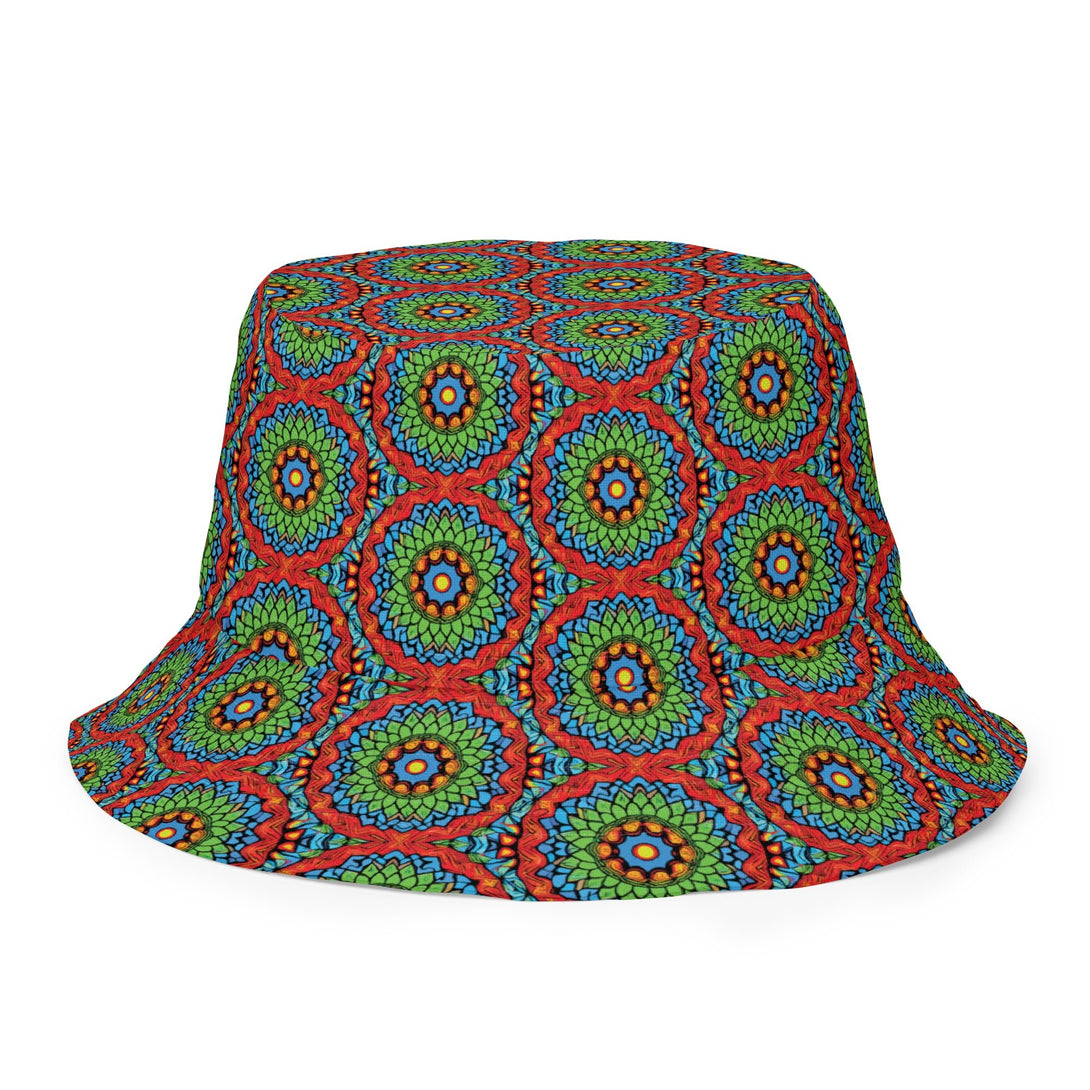 reversible bucket hat with an abstract print in green, blue, red and orange by The Gabrielli