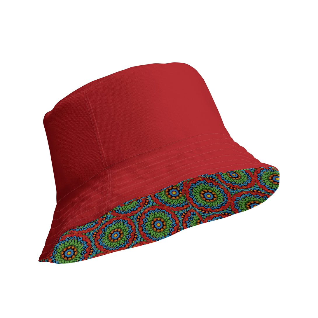 reversible bucket hat with an abstract print in green, blue, red and orange by The Gabrielli