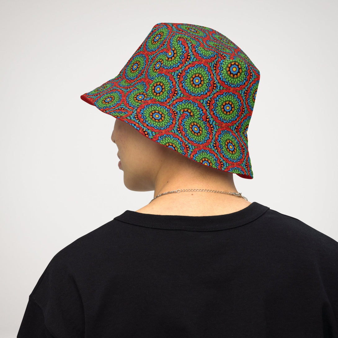 reversible bucket hat with an abstract print in green, blue, red and orange by The Gabrielli